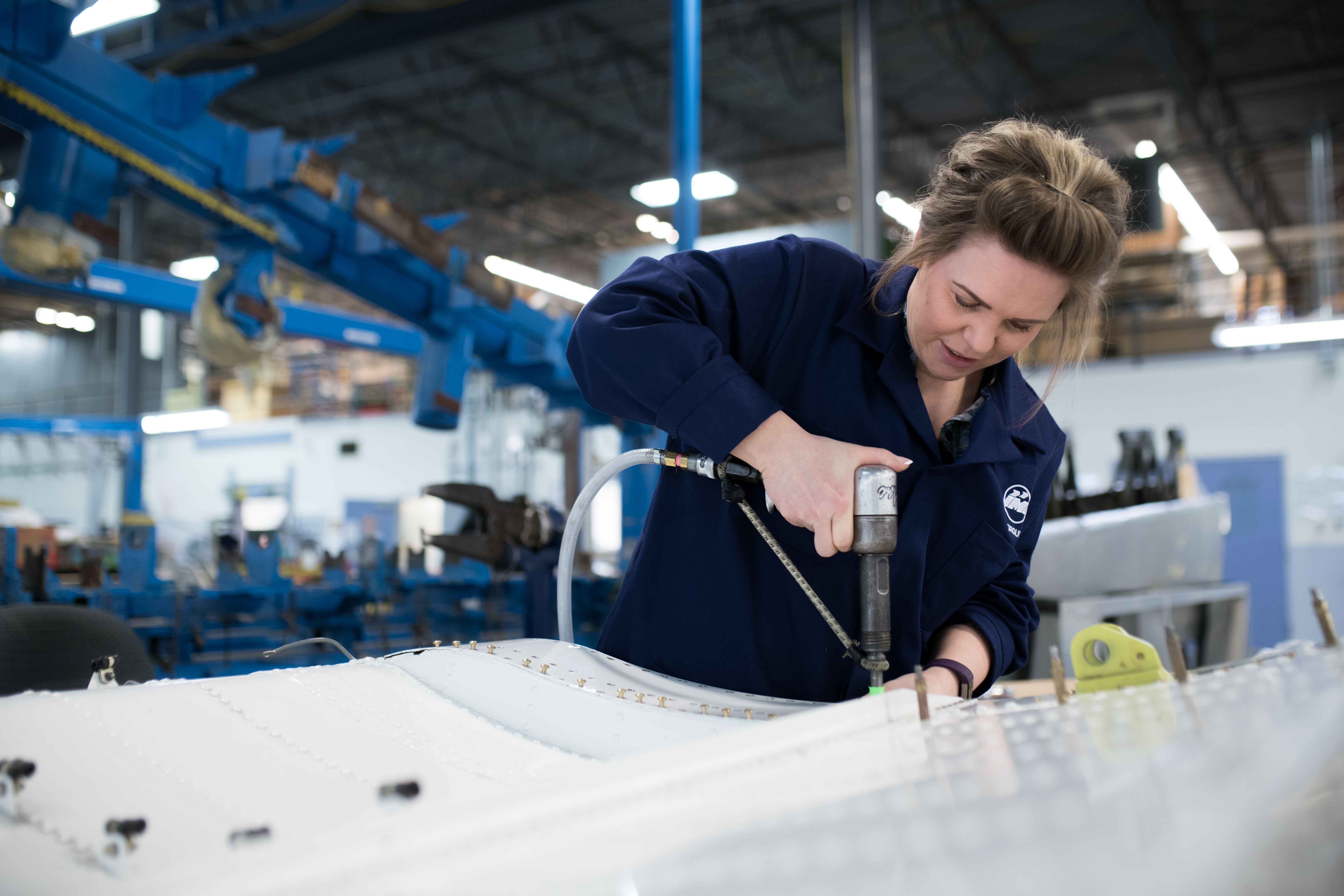 Aircraft technician working on a part