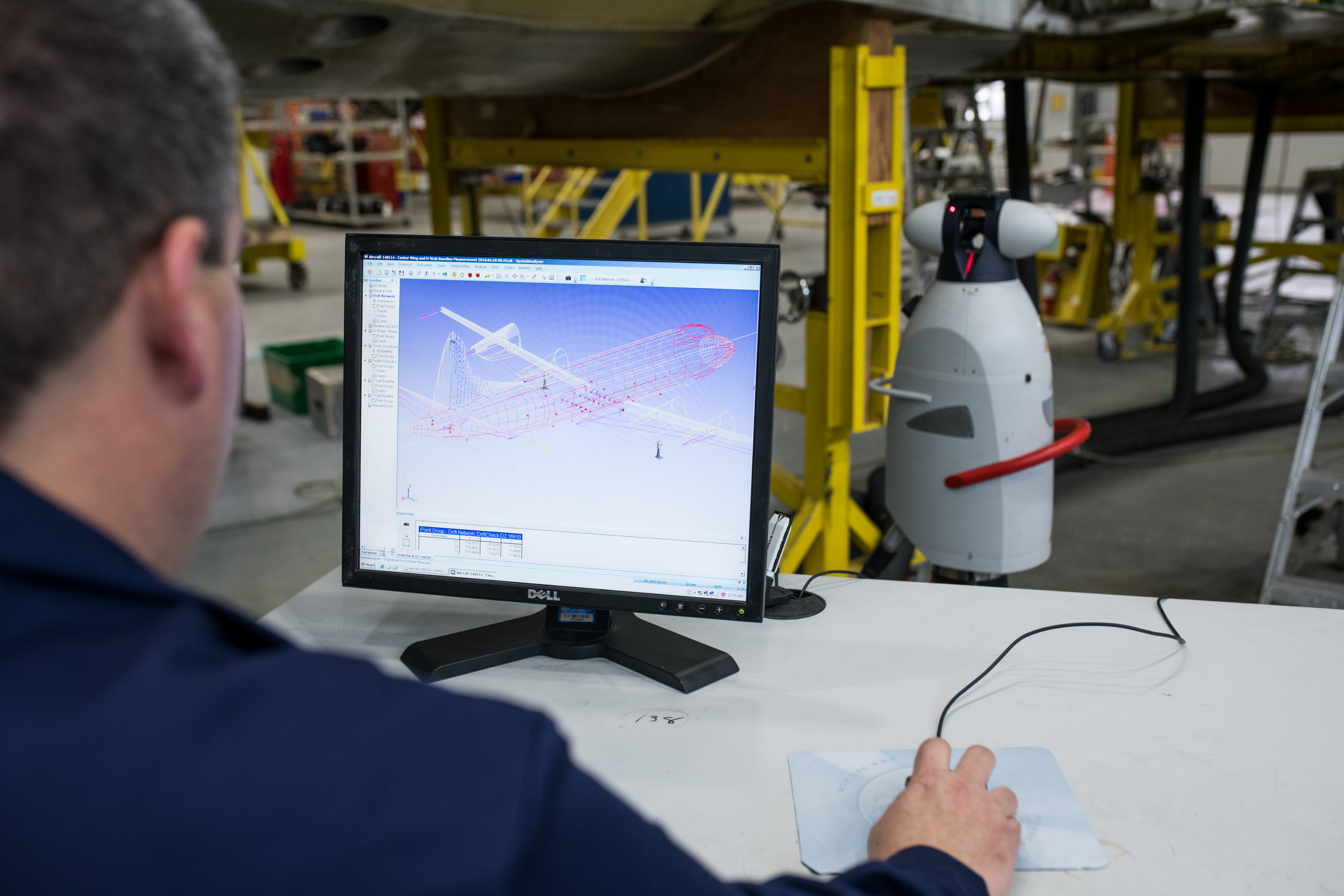 Engineer working on drafting the body of an aircraft on a computer