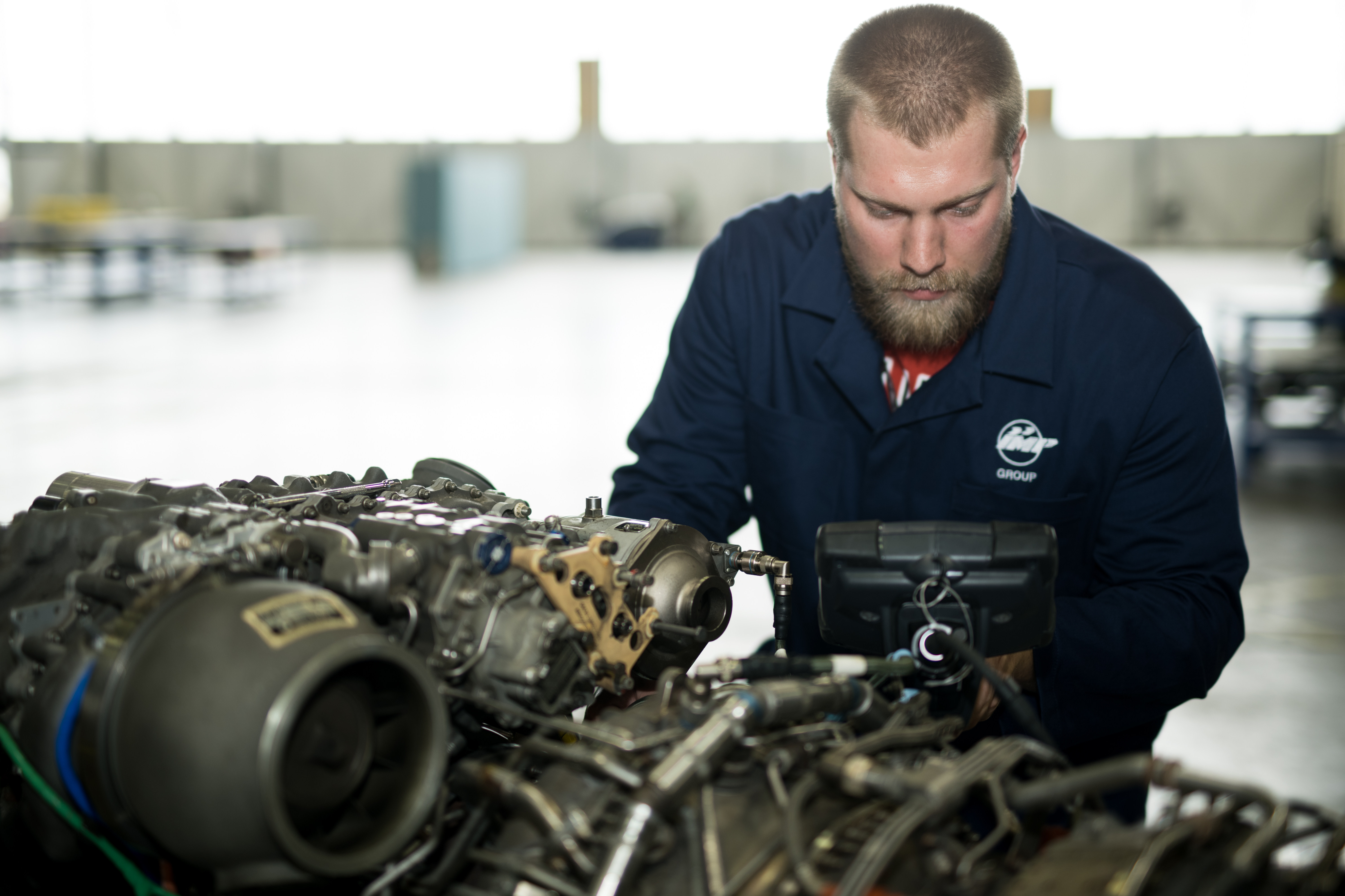 Aerospace technician working on an aircraft component