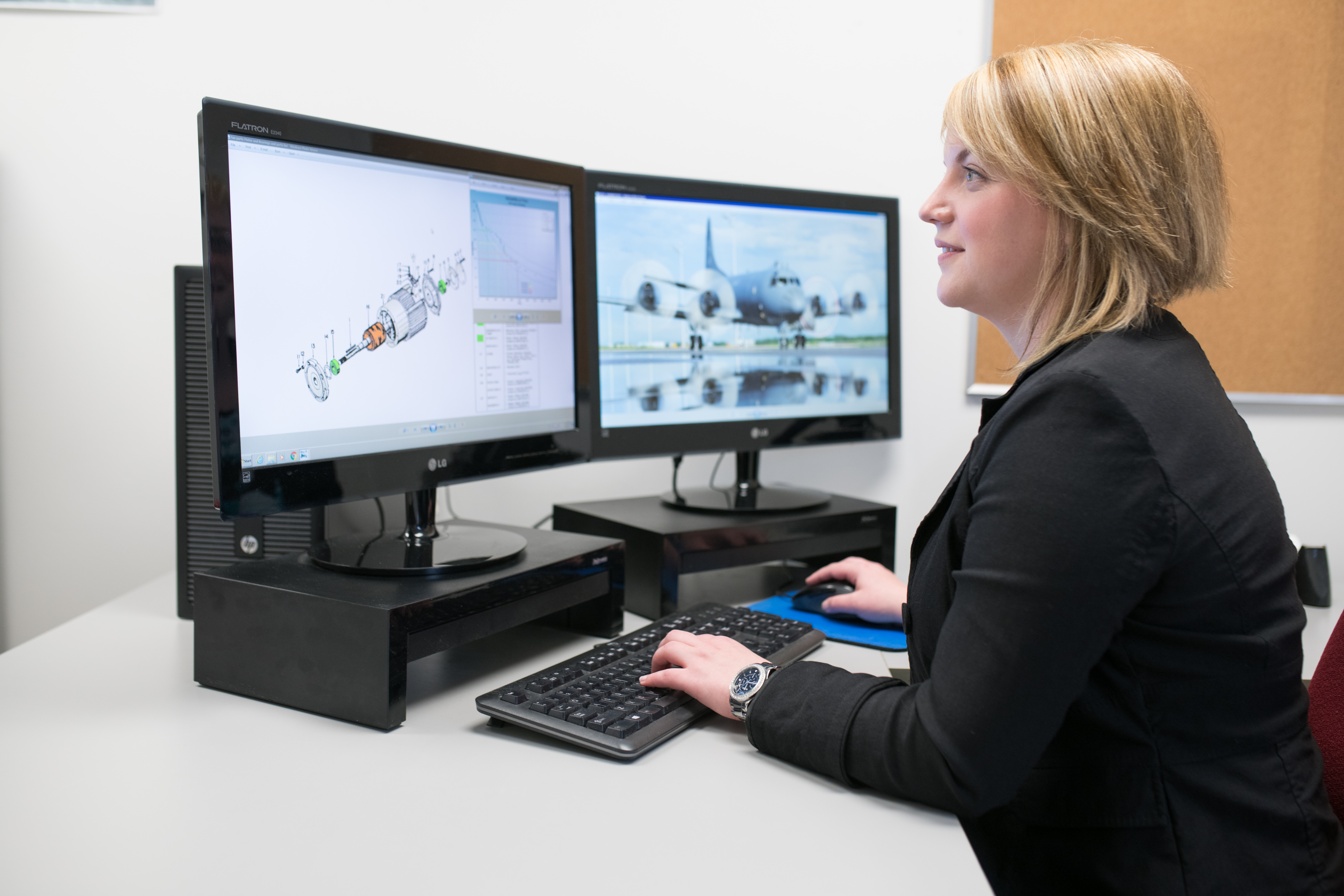 Engineer working on renderings of an aircraft component