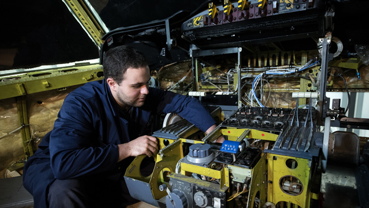 Technician performing aircraft modifications