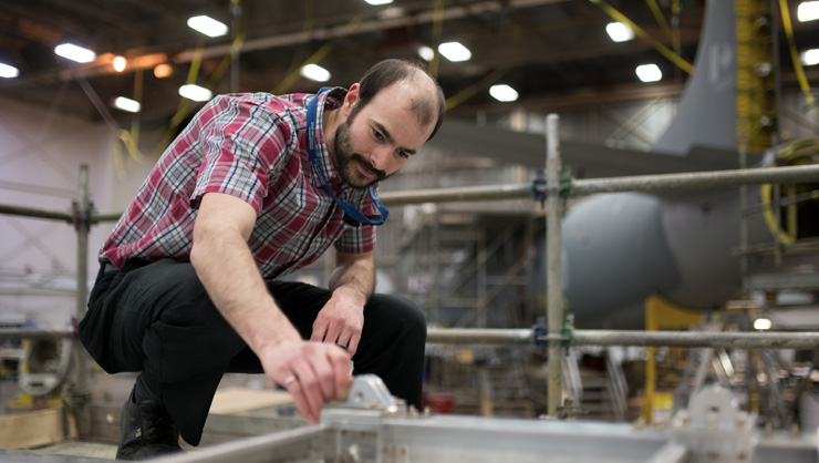 Aircraft engineer working on an aircraft component