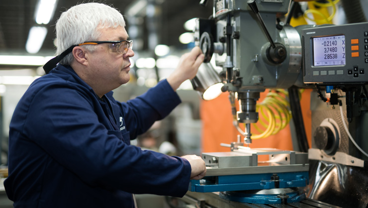 Technician working on a piece of aerospace equipment